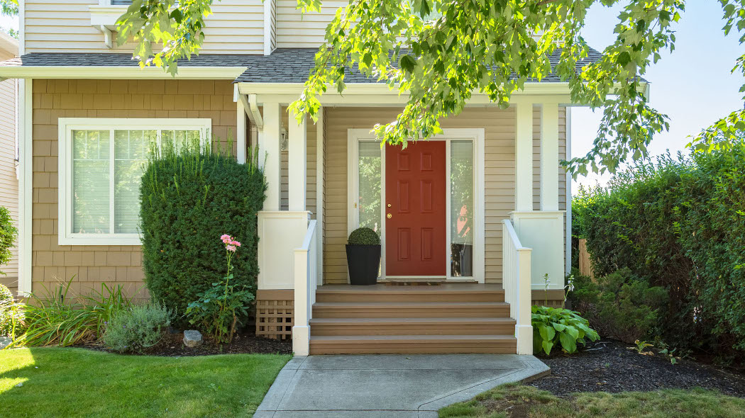 House porch with a red door